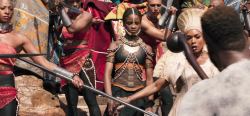 sleepynegress: This is the scene where M’Baku calls out Shuri during the challenge. I love that everyone surrounding her snaps to action, but please check out Shuri’s body-language here.  Look at her face.She is looking M’Baku dead in the eye. 