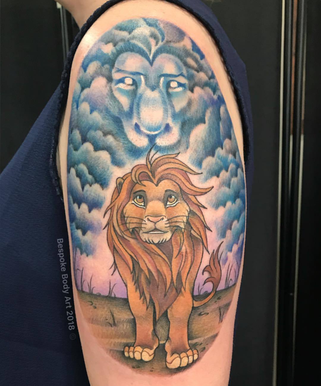 Minimalistic Simba tattooed on the wrist.