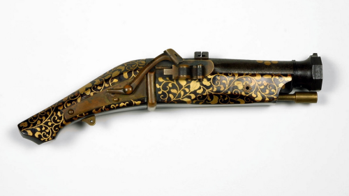 Edo Period Japanese Matchlock PistolDecorated with gold and silver with lacquered wood.