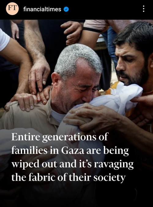 A screenshot of an Instagram post by the financialtimes account. It pictures a crying Palestinian man, middle aged or older, holding a shrouded child against his face. There is one man visible on the right side, holding his hand which is carrying the child, and another wrapped around his shoulder. Others are around them, reaching out to him. The text overlayed reads: Entire generations of families in Gaza are being wiped out and it's ravaging the fabric of their society.