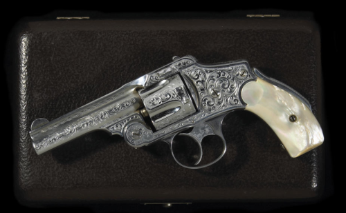 A cased and engraved Smith & Wesson 1st Model Hammerless double action revolver with pearl grips