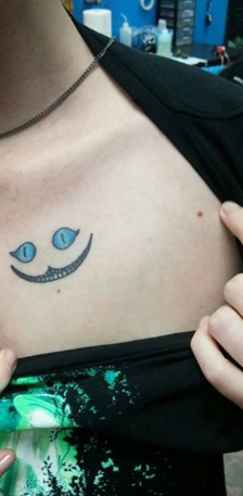 sixpenceee:  An ultraviolet tattoo of the cheshire cat from Alice in Wonderland. Facebook | Instagram | Scary Story Website