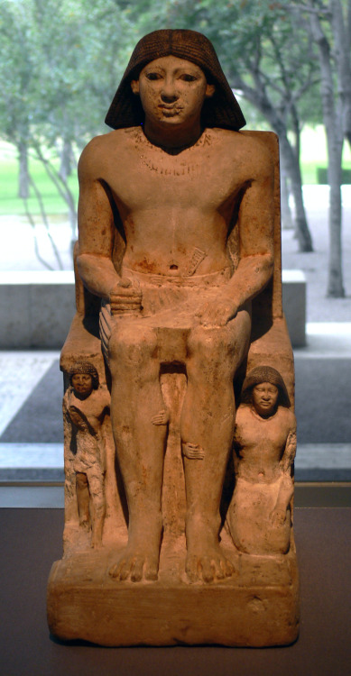 Ancient Egyptian statue depicting a man called Ka-Nefer and his family.  Carved from limestone and p