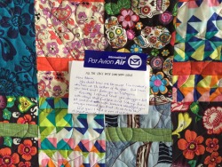 buzzfeed:  yrbff:  adamjk:  something truly amazing happened to me today.   I went to the post office to drop off some mail and there was a quilt waiting for me. a woman from new zealand, a total stranger, wrote me a letter on a page from my book and