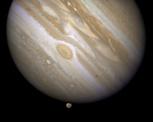 Giant Jupiter Eclipses Its Moon Ganymede. Courtesy Of NASA, ESA, And E. Karkoschka (U. Arizona).