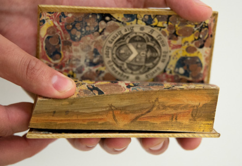 Did you know some books contain hidden images? Fore-edge painting, or decorating the closed leaves o