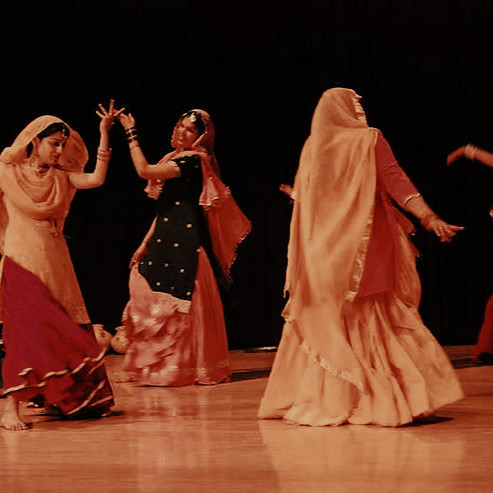 punjabi women in flowing ghagras dancing
