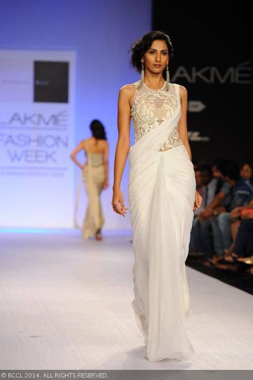 White chiffon sari with stunning embroidered net blouse by Sonaakshi Raj