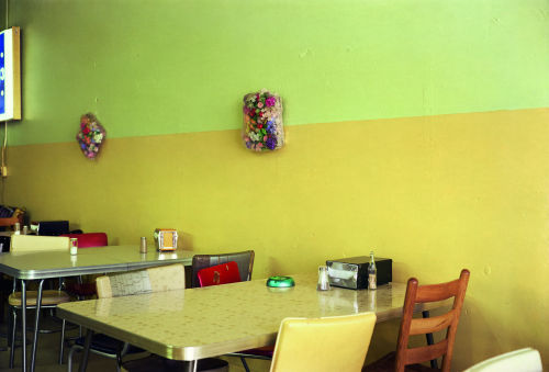 William Eggleston(American; 1939– )Untitled (Yellow Café) | from the artist book “Election Eve”Color