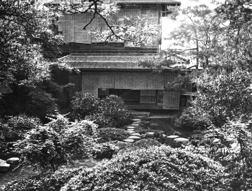 Tokyo, Japan - Typical view on a garden located directly at a private house in Tokyo city around 100 years ago. Stepping