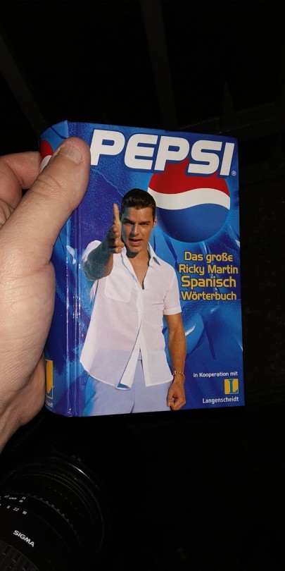 garbage-empress:shiftythrifting:  A Pepsi branded, Ricky Martin themed, Spanish/German dictionary. That’s one heck of a madlibs of an item.    