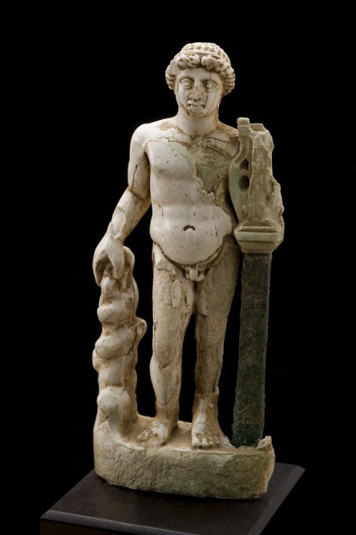 lionofchaeronea: Roman ivory statue of Apollo, shown holding a lyre.  Artist and date unknown.  Phot