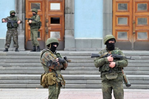 gunrunnerhell:  The Russians Heavily-armed soldiers without identifying insignia guard the Crimean parliament building after taking up positions there earlier in the day on March 1, 2014 in Simferopol, Ukraine. The soldiers’ arrival comes the day after