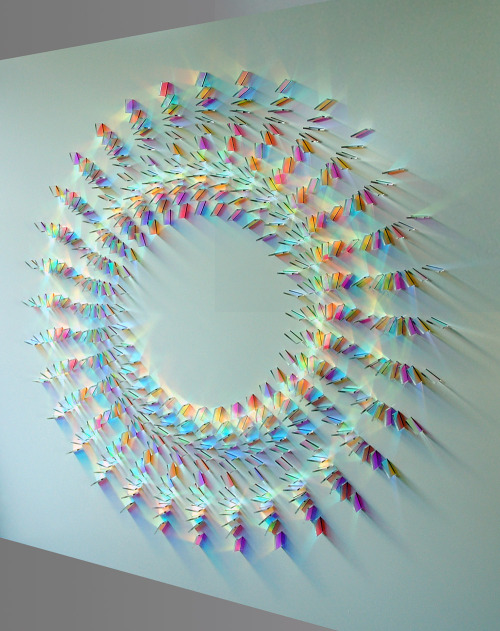 coolthingoftheday:    Artist Chris Wood works with colored glass to create colorful, prism-like mazes and mandalas of light installed vertically on walls.   (Source)