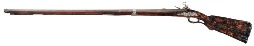 Early 18th century miquelet fowling musket with beautiful silver mounted rootwood stock.