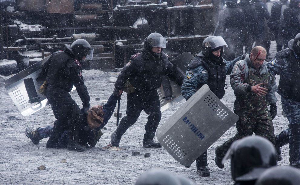 politics-war:  Police detain protesters during a clash in central Kiev. 