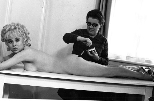 Barbara Windsor getting touched up by the makeup lady on the set of Carry On Again Doctor (1969).