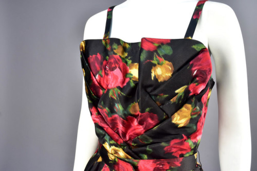 historicaldress: SUZY PERETTE WARP PRINTED COCKTAIL DRESS, 1950s Sleeveless black satin with colorfu
