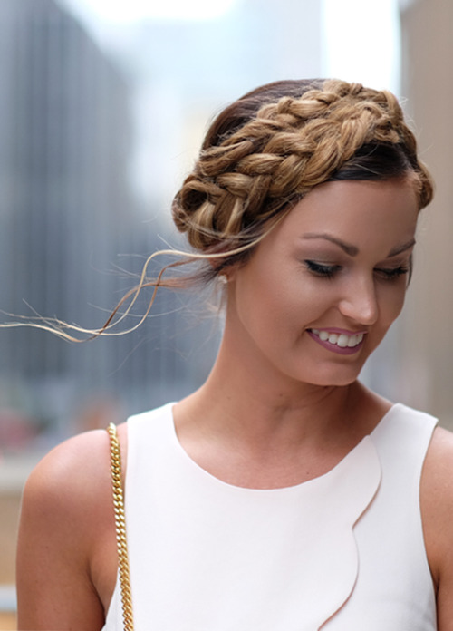 Spotted: Milkmaid Braids in Manhattan! We love the wispy movement in this New York Fashion Week updo