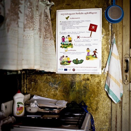 Information sign warning children of mines in the kitchen in Nikozi after the russian georgian war 2