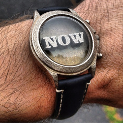 xombiedirge:  The ‘NOW’ Artwatch by Troy Gua / Tumblr Bronze-infused stainless steel case, 3D printed front with a slightly pitted surface finish for that vintage, steam punk look. High quality domed GS acrylic crystal. Available HERE. &ldquo;What