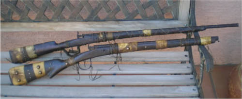 A pair of handmade percussion muzzleloading rifles of Apache origin, 19th century.