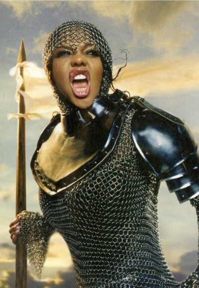 flamejob:ruby commey as germania (rammstein - “deutschland”) // lil kim as joan of arc (flaunt magazine)