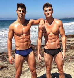 itsswimfever:  Two muscleboys at the beach.