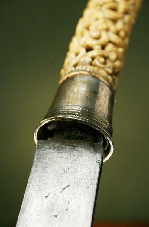 art-of-swords:  Burmese Dha Sword Dated: circa 18th century Culture: Burmese Medium: steel, ivory (or bone), copper, wood, silver  Source: Copyright © 2013 Historical Arms & Armor 
