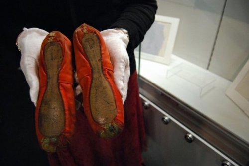 Rachel Hall, daughter of The Red Shoes star Moira Shearer, holding the original pair of slippers her