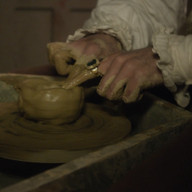 a frame from what we do in the shadows (2014), showing a close up on viago making (presumably) a bowl out of clay. he is wearing a white shirt with frilly cuffs, which appear to be in danger of getting clay on them.