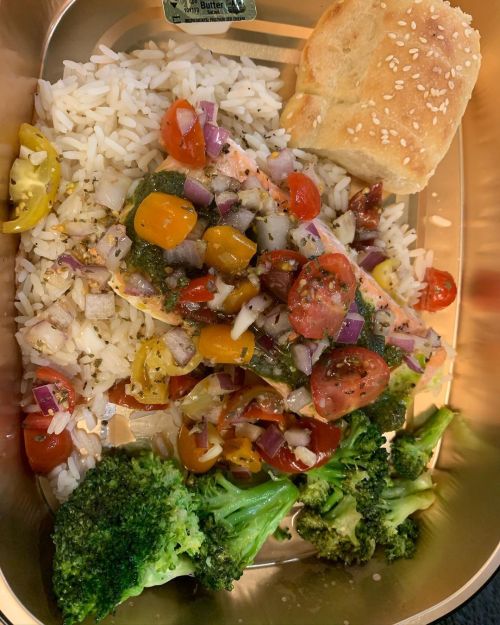 Pesto Salmon, Tofu, and Chicken with tomato basil salsa. Accompanied by white rice and sautée