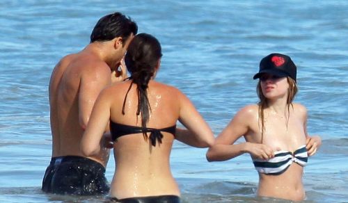 toplessbeachcelebs:  Avril Lavigne (Singer) bikini nipple slip in Malibu, California (August 2010)