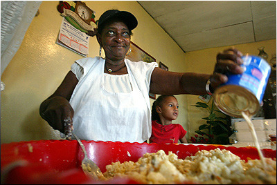 yearningforunity:
“ Carmen Joseph, a caterer and mother of eight children in Bluefields, Nicaragua, prepares potato salad as her granddaughter Britney Cash, 5, stands by. ‘Some folks don’t say they are what they are,’ she said. ‘You see, I am black,...