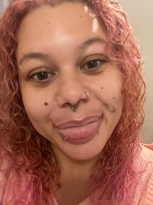 a picture of OP sticking their tongue out: light pink/peach curly long hair and skin like potato salad(litebrite)