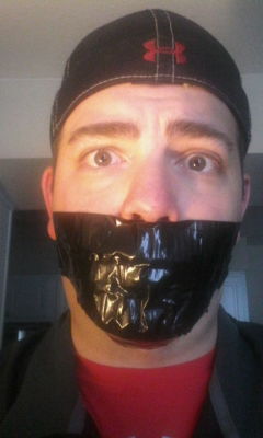 bondagejock:  Selfie with duct tape gag 