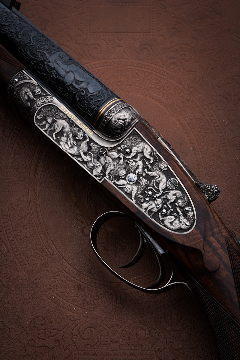 thegildedrage:Westley Richards rifle engraved with lion scene.