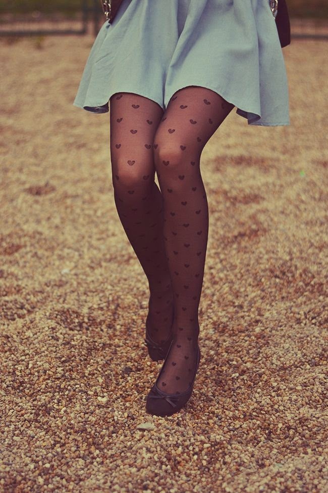 pantyhoseparty:  Detail photo of heart patterned black pantyhose, blue skirt and