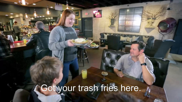 46% sure it's a group of people playing instruments and performing on a counter. Caption: Got your trash fries here.