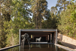 dezeen:  Stable built from railway sleepers