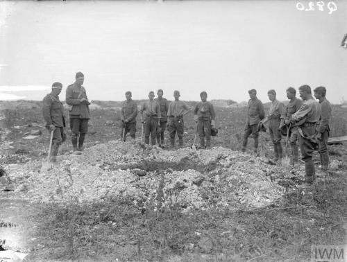 A chaplain conducting a burial service on the battlefield near Ovillers, middle of July 1916.