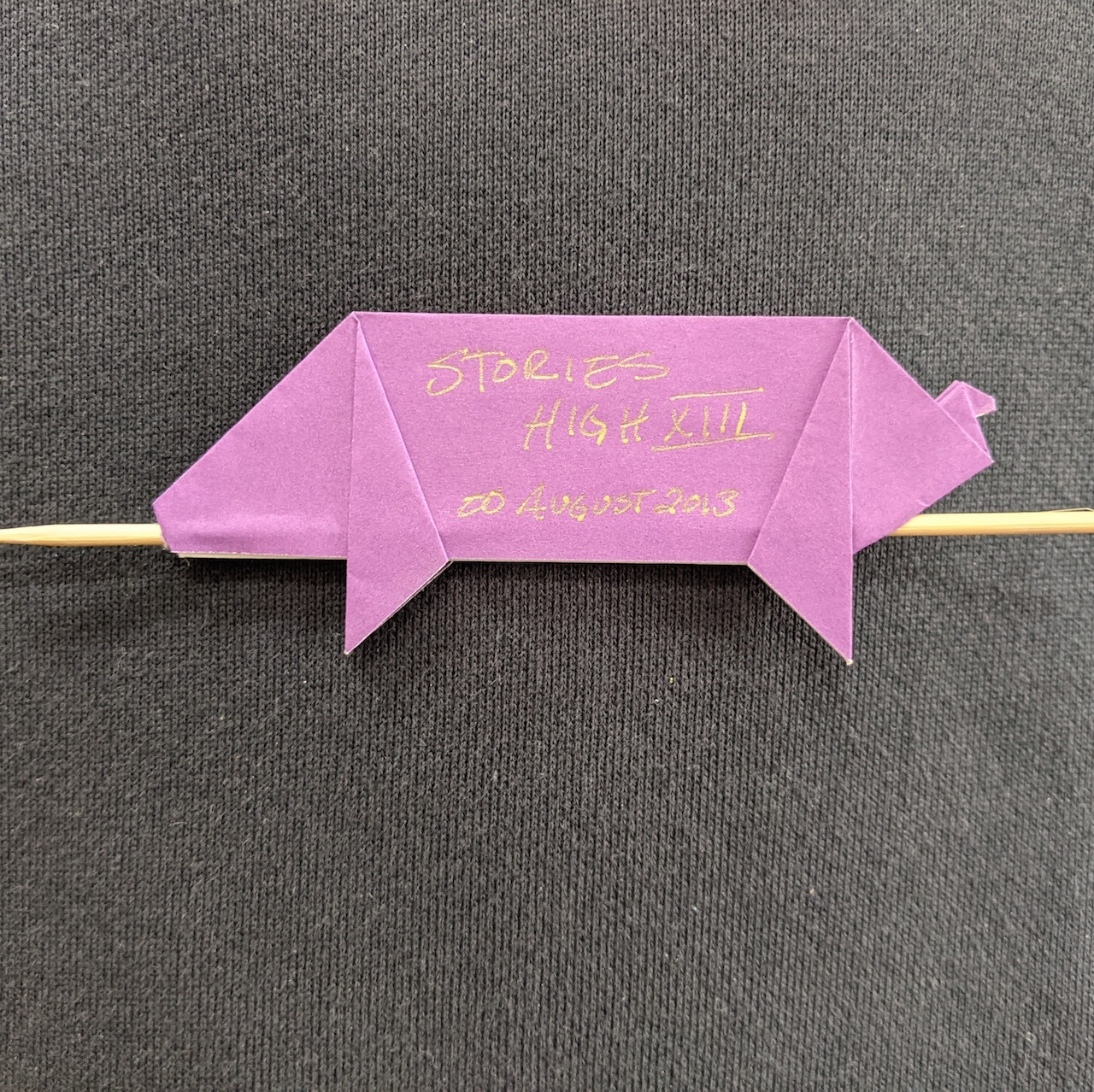 A closing night gift of an 2 inch origami of a lechon on a toothpick given to EVERYONE involved with Stories High 13, the annual page-to-stage festival produced by Bindlestiff Studio, San Francisco, CA