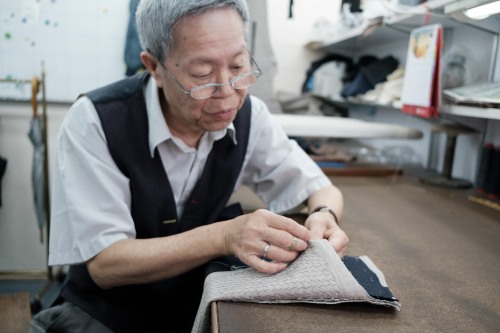 Working on bespoke suits in our factory. - Ascot Chang