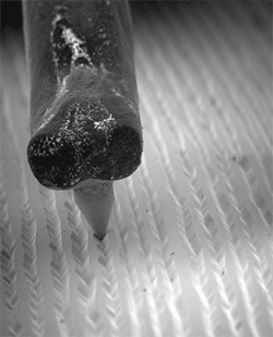blazepress:  Microscopic footage of a needle moving across a vinyl record.