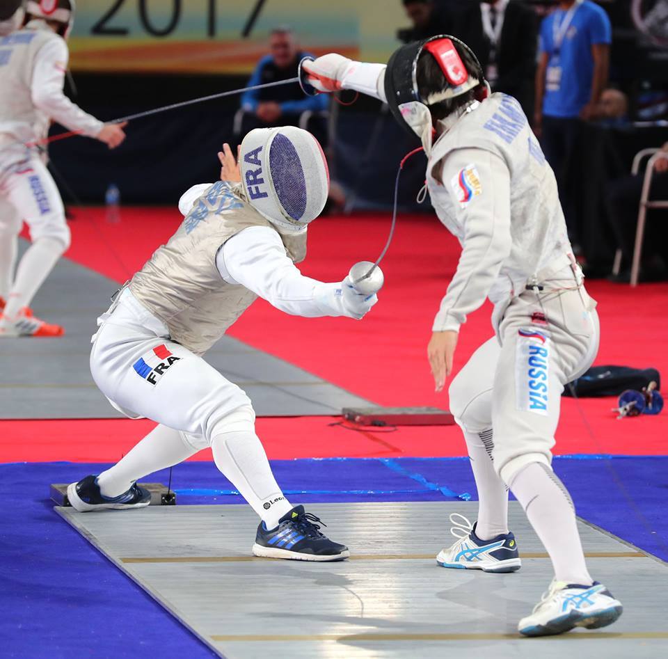 modernfencing: [ID: a foilist hitting his opponent just before going off-strip.]