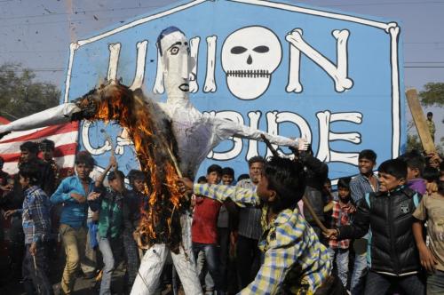 Bhopal, India - Dec. 3, 2016: Gas affected people burning an effigy of Union Carbide and Dow chemica