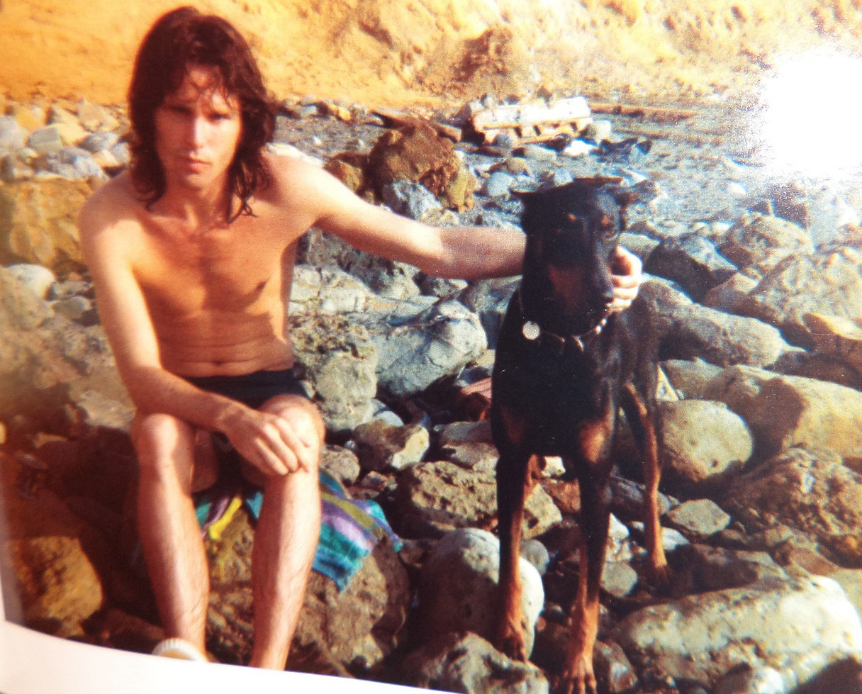 americandionysus:Jim Morrison with Ray Manzarek’s doberman, Thor, 1965