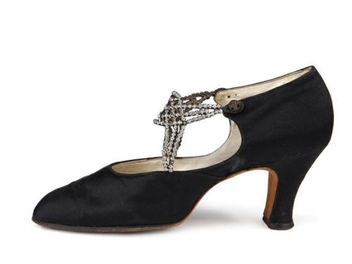 D'Orsay black satin pumps with straps formed by rows of rhinestones in bezels closing on two buttons