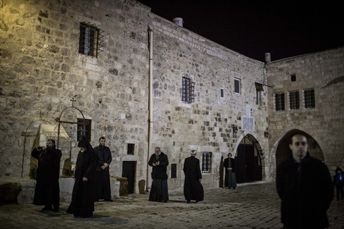 Armenian priests and seminar students attend a prayer welcoming the New Year, at midnight, in the Ar