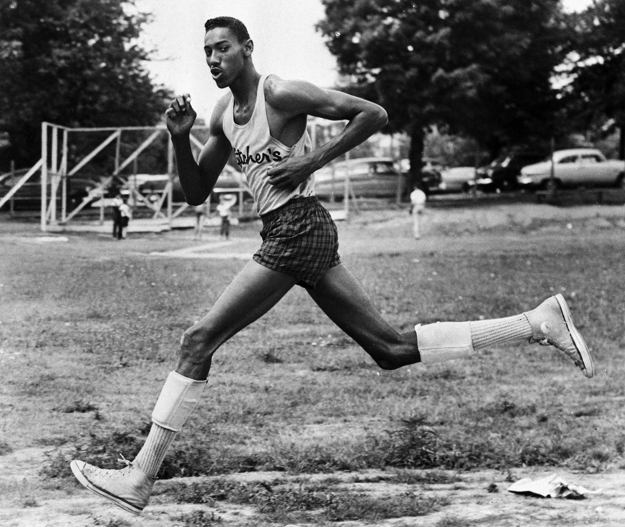 coolkidsofhistory:  Wilt Chamberlain running high school track, 1954.